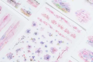 Close-up detail view of romantic cherry blossom watercolor decorative stickers for journal diary.