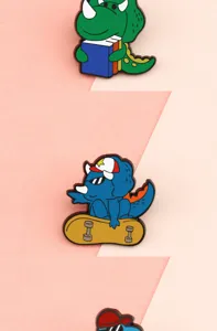 Cute cartoon dinosaur enamel pin set, stylish metal badge for clothes and bags decoration.