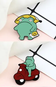 Cute green frog enamel pin set, cartoon animal lapel badge, aesthetic backpack accessory.