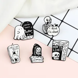 Set of 5 black and white gothic metal enamel pins featuring cute spooky skulls and ghosts.
