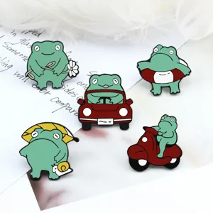 Cute green frog enamel pin set, funny cartoon animal metal badges for backpacks, jackets, and hats.
