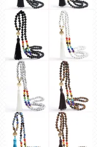 Chic chakra lava stone beaded necklace with tree of life pendant and tassel charm.