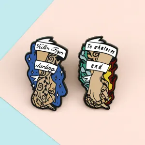 Enamel pin set featuring hand holding design with inspiring quote text, stylish metal alloy brooch.