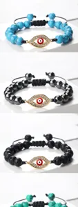 Bracelet tressé mauvais œil avec perles de turquoise, hématite et lave, pendentif strass étincelant.