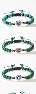 Bracelet de perles avec mauvais œil bleu et cordon tissé réglable pour femmes élégantes.