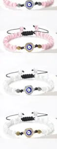 Bracelet de perles mauvais œil avec pierres œil de chat roses et blanches cordon réglable.
