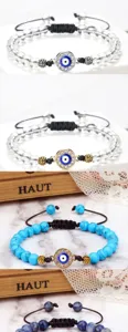 Bracelet de perles avec mauvais œil et cordon tressé réglable pour un style élégant.