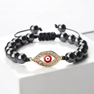 Bracelet de perles mauvais œil avec strass en cristal rouge et cordon réglable.