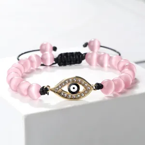 Bracelet en perles de pierre œil de chat rose avec charm œil maléfique doré réglable cordon
