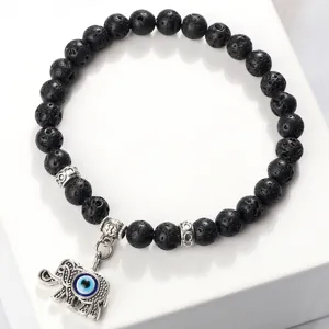 Bracelet en perles de pierre de lave noire avec pendentif éléphant et motif mauvais œil