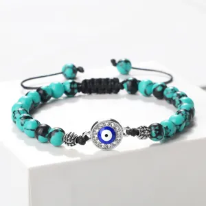 Bracelet perles turquoise avec pendentif mauvais œil bleu cordon tissé réglable vue principale