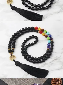 Collana di perline in onice nera e 7 chakra con ciondolo albero della vita e nappa.