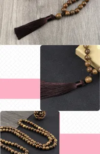 Wooden beaded necklace detail showcasing natural wood texture and elegant brown tassel.