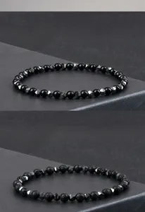 Pulsera elástica de cuentas de hematita negra y piedra volcánica para hombres top.