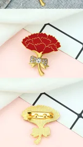Close-up detail shot of the gold red carnation brooch showing front and back pin structure.
