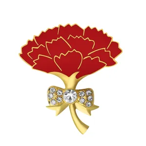 Elegant red carnation brooch with gold bow and sparkling rhinestones for chic women's suits.