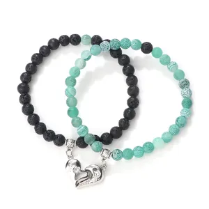 Magnetic couple beaded bracelet set featuring black lava stone and green crackle agate beads.
