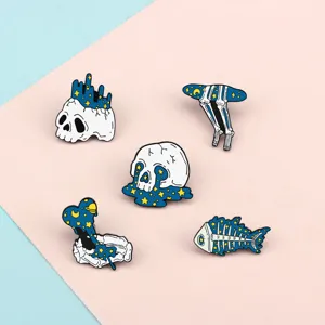 Creative starry skull enamel brooch set, unique gothic bone badge for trendy clothing decor.