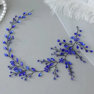 Close-up detail shot of the blue crystal rhinestone hair vine, featuring delicate wire braided design.
