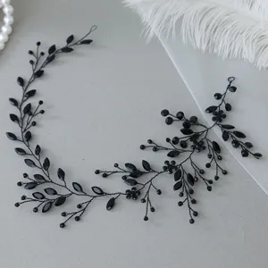 Close-up of black crystal hair vine, detailed rhinestones and beads for elegant hairstyles.