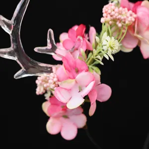 Exquisite deer antler flower headband detail, forest style fairy hair accessory for holiday party.
