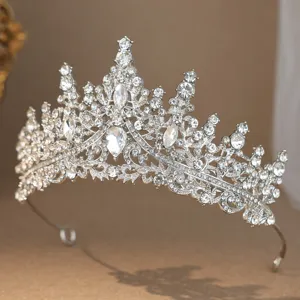Detailed shot of sparkling silver rhinestone tiara crown for bridal wedding hair accessory.