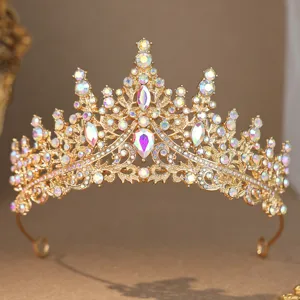 Close-up detail of luxury gold bridal tiara sparkling with iridescent rhinestones for wedding.