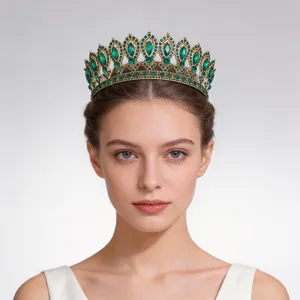 Detailed closeup of luxurious baroque green rhinestone gold crown tiara for bridal wedding.