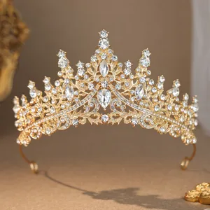 Close up detail of sparkling gold tiara with clear rhinestones, bridal hair accessory.