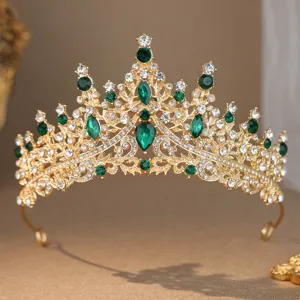 Stunning gold rhinestone crown detail, elegant green and white crystal tiara for bridal wedding.