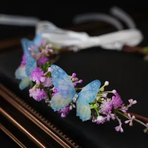 Floral hair wreath with blue butterflies and purple flowers, perfect for wedding or cosplay.