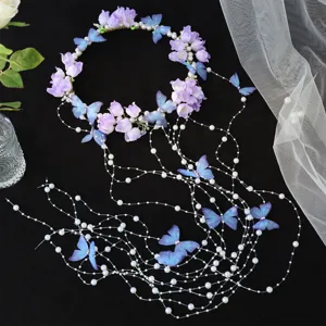 Bridal floral headband with purple flowers blue butterflies and pearl hair tassels for wedding.