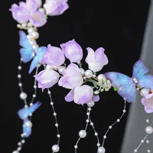 Handmade purple fabric flower butterfly headband with faux pearl tassels for bridal wedding.