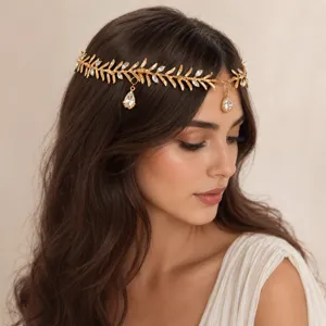 Serre-tête feuille dorée avec goutte en cristal, accessoire de cheveux style grec chic.
