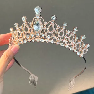 Exquisite rose gold rhinestone bridal tiara detail, elegant princess crown hair comb accessory.