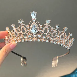 Rose gold rhinestone bridal tiara detail, sparkling crystal wedding hair comb accessory.