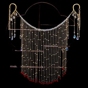 Handmade gold tassel face chain veil detail showcasing intricate metallic chains and crystal beads.
