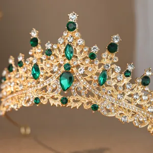 Exquisite gold rhinestone tiara with green gems, perfect bridal and wedding hair accessory.