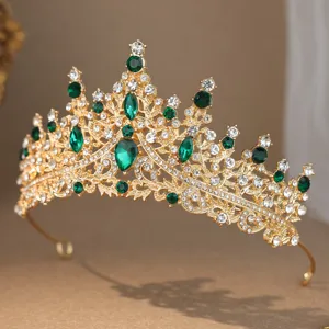 Gold rhinestone crown tiara detail, elegant green crystal bridal hair accessory for weddings.