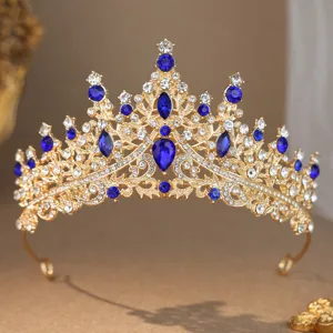 Exquisite gold crystal tiara detail, sparkling blue and clear rhinestones for bridal hair.