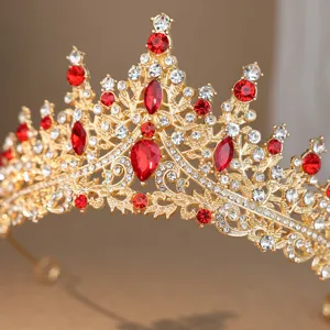 Close up of luxury gold crystal tiara wedding bridal hair accessory sparkling red rhinestones detail