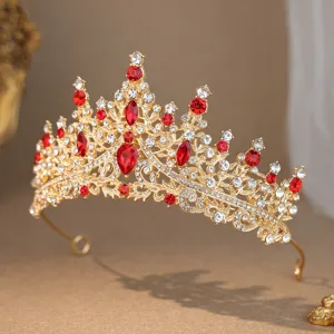 Close-up detail shot of exquisite gold crystal rhinestone crown, bridal hair accessory.