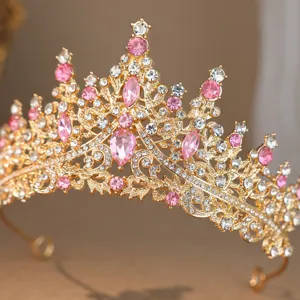 Gold rhinestone crown detail, sparkling pink crystal bridal tiara for wedding party.
