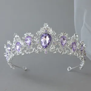 Elegant silver bridal tiara featuring sparkling purple teardrop rhinestones for events.