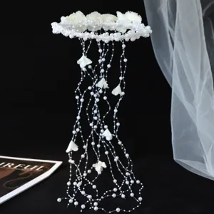 Detailed shot of bridal pearl tassel hair vine, exquisite handmade wedding floral headpiece.