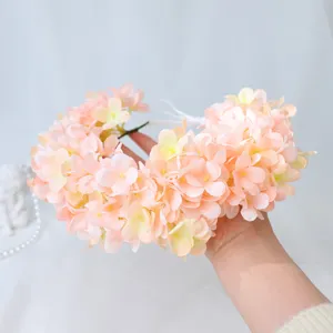 Detailed view of sweet artificial hydrangea flower crown, perfect bridal wedding hairband accessory.