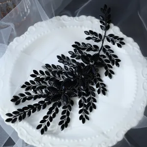 Black crystal bridal hair vine detail, elegant rhinestone wedding hair accessory for women.