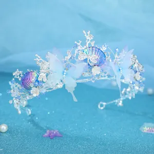 Close-up detail of the ocean themed blue butterfly rhinestone tiara crown hair accessory.