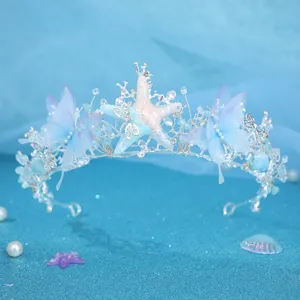 Ocean blue butterfly rhinestone tiara detail, sparkling starfish wedding bridal headpiece.
