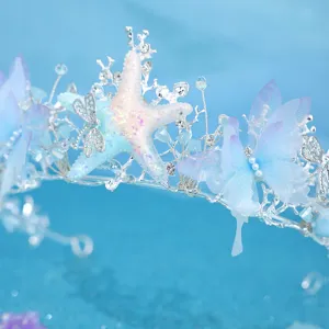 Close-up of ocean starfish butterfly crystal tiara bridal hair accessory detail view.
